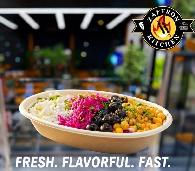 A colorful bowl from Zaffron Kitchen with feta, pickled cabbage, olives, and chickpeas.