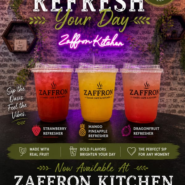 Three Zaffron refreshers: strawberry, mango pineapple, and dragonfruit, on a dark counter with a neon sign.