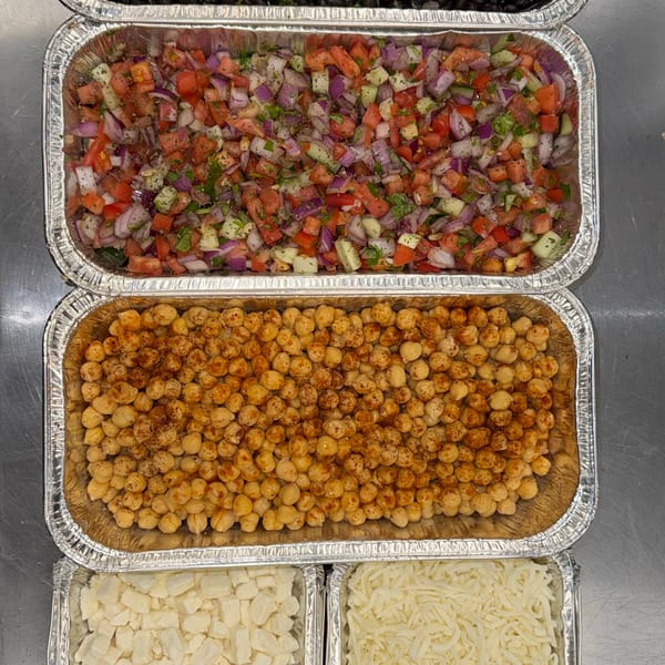 Five foil trays filled with black beans, pico de gallo, chickpeas, cheese curds, and shredded cheese.